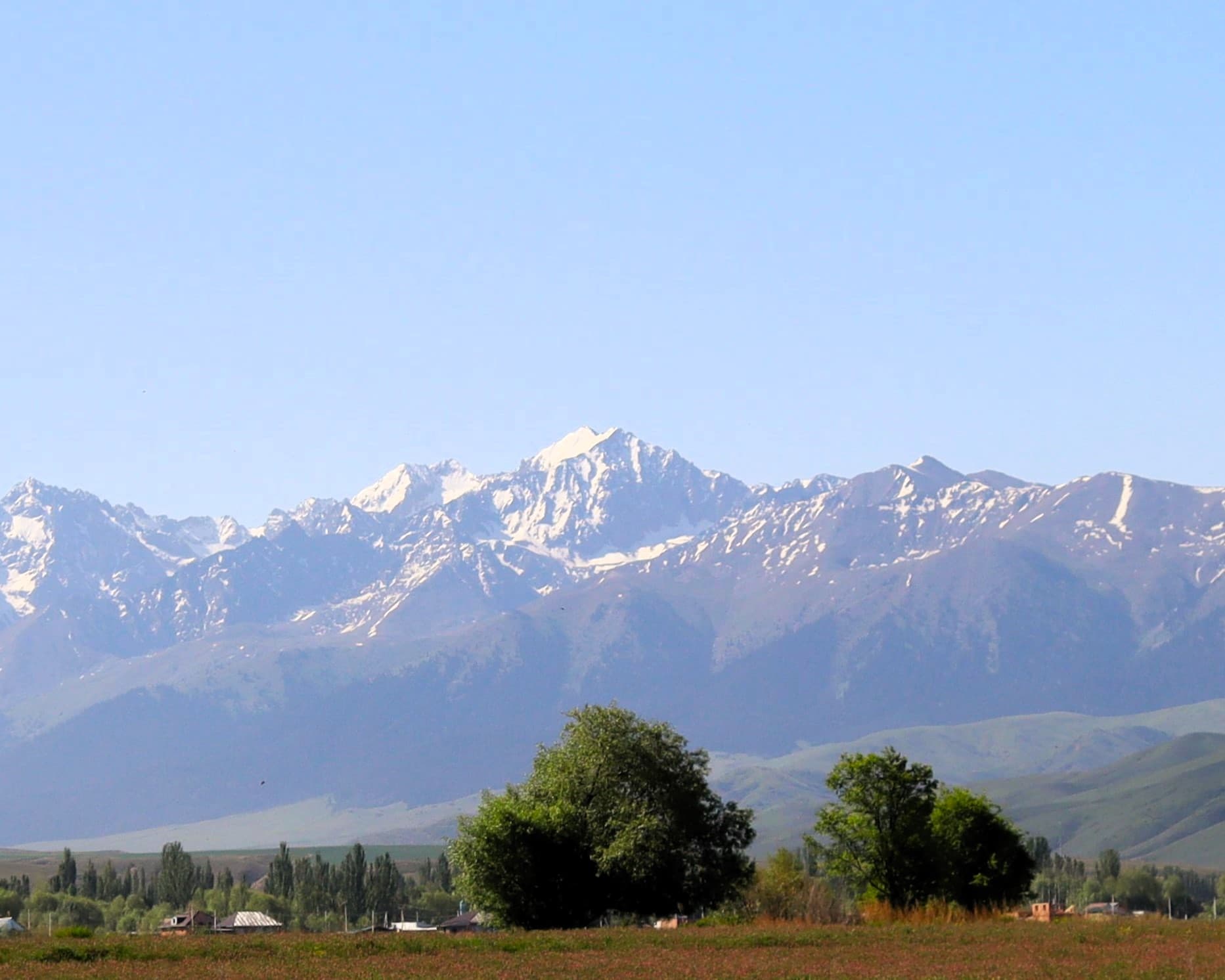 The peak Jiluu Suu stand snowcapped part of the Teskei Alatoo range