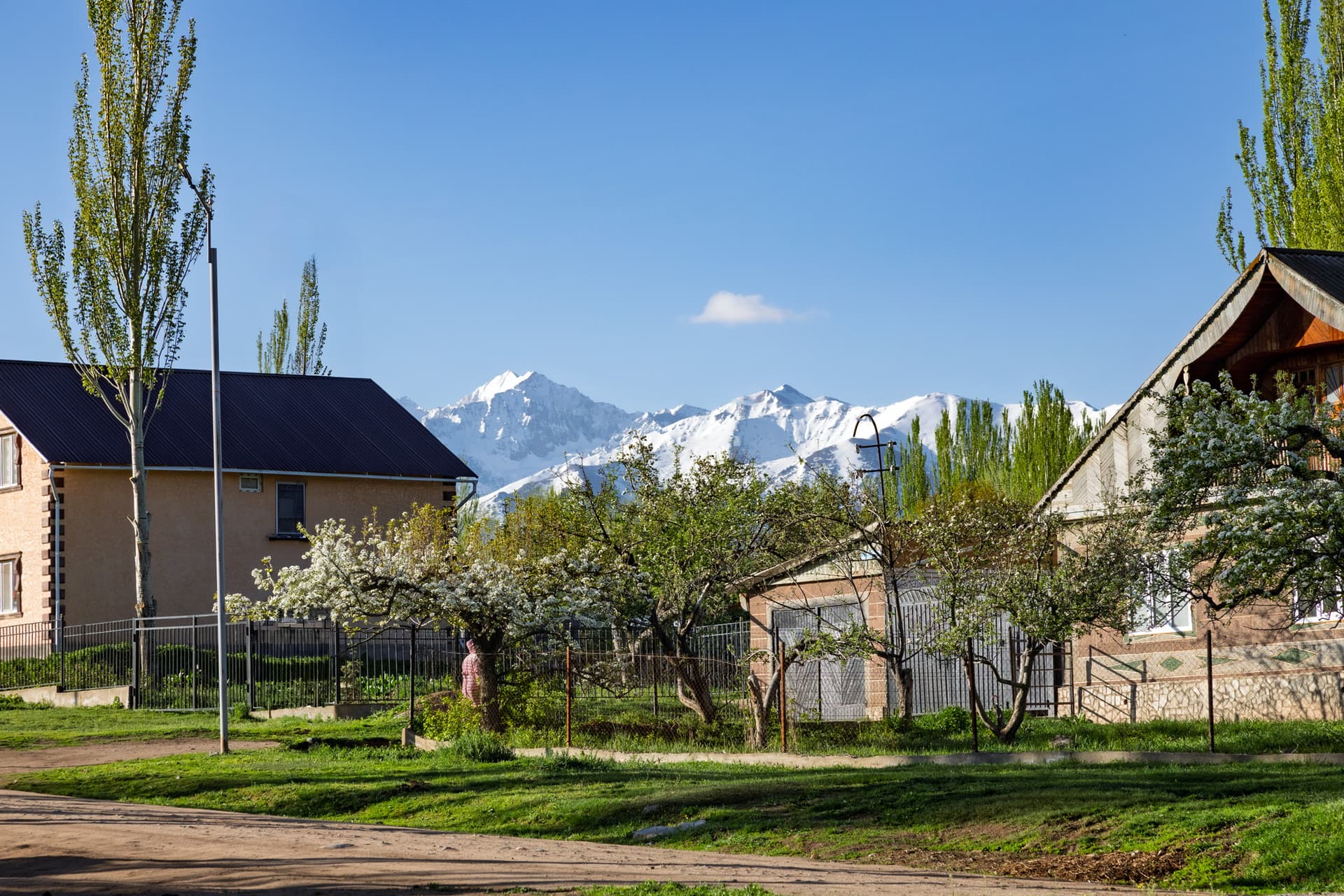 Houses and mountains in Svetlana Polyana in spring